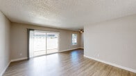 Located at 8059 Targa Cir in Citrus Heights, CA, this 2-bedroom, 1-bathroom unit offers a well-organized single-floor layout designed for comfortable everyday living. The open living room is a bright, welcoming space featuring wood-look flooring, neutral-toned walls, and a textured ceiling. Large sliding glass doors and an additional window flood the area with natural light while providing outdoor views, and a ceiling fan adds year-round comfort. The kitchen is efficiently designed with white cabinetry, a peninsula breakfast bar, stainless steel appliances including a refrigerator and dishwasher, and a recessed light overhead — offering both style and practicality. Both bedrooms feature wood-look flooring, textured ceilings, and windows that bring in ample natural light. The primary bedroom includes a sliding double-door closet for generous storage. A hallway connects the main living areas to the bedrooms and the full bathroom, which is appointed with a tub/shower combo with tile surround, a vanity with granite-style countertop, and built-in cabinetry. Clean finishes, consistent flooring, and a neutral color palette give the space a cohesive, move-in-ready feel throughout.