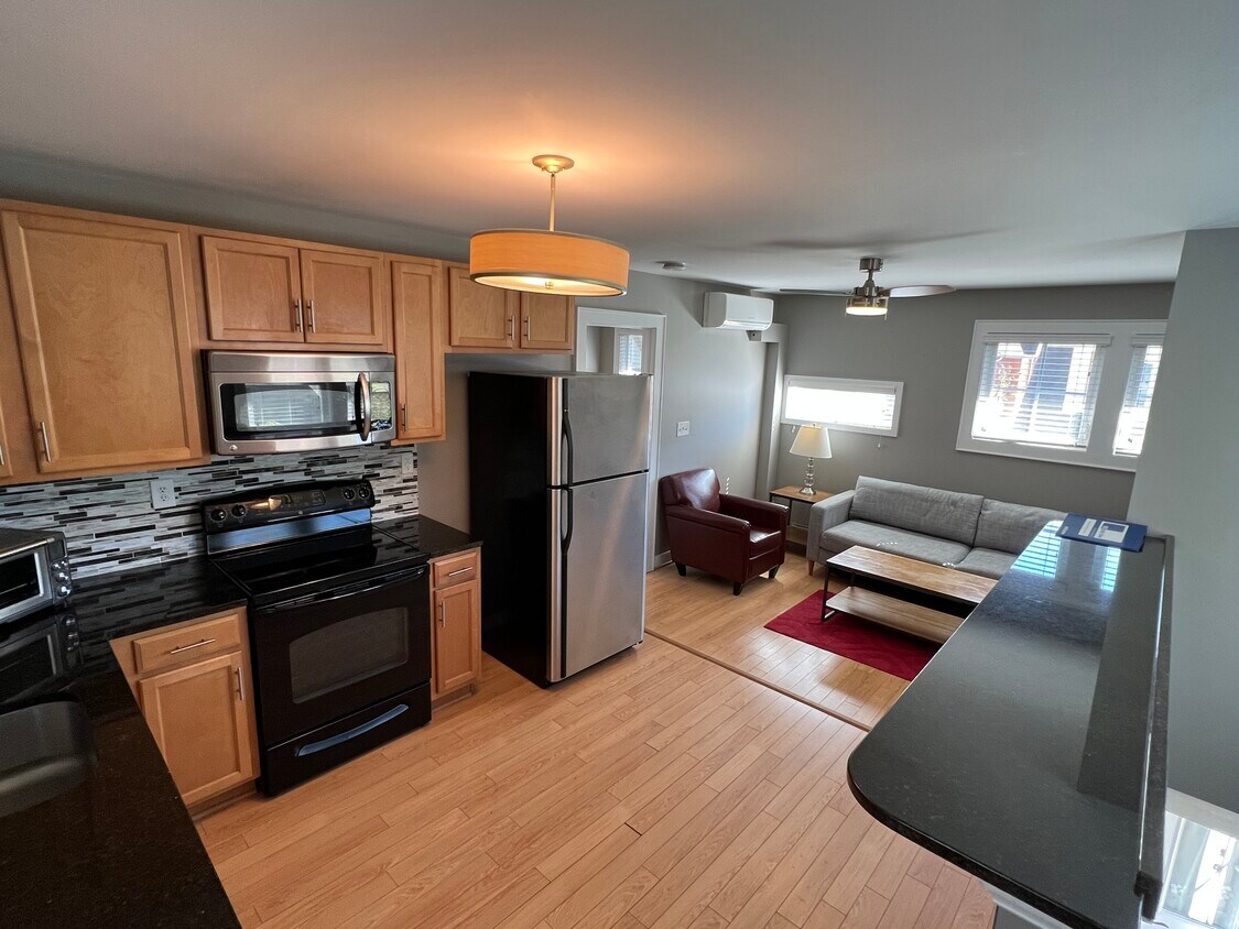 Open Concept Kitchen/Breakfast Bar & Living Room - 105 Caty Ln