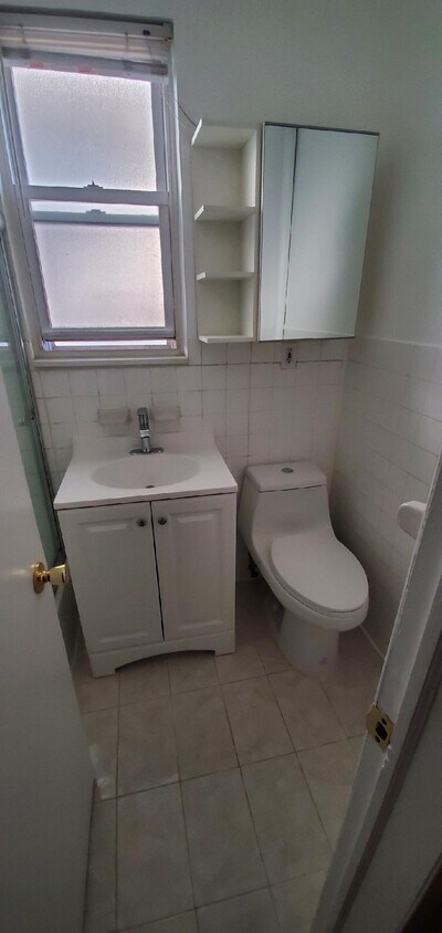 Bathroom new sink and toilet - 227 15th St