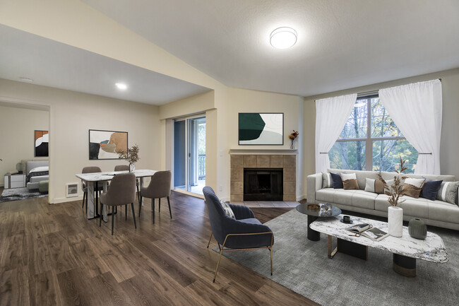 Renovated Package I dining and living room with hard surface flooring - Avalon at Bear Creek