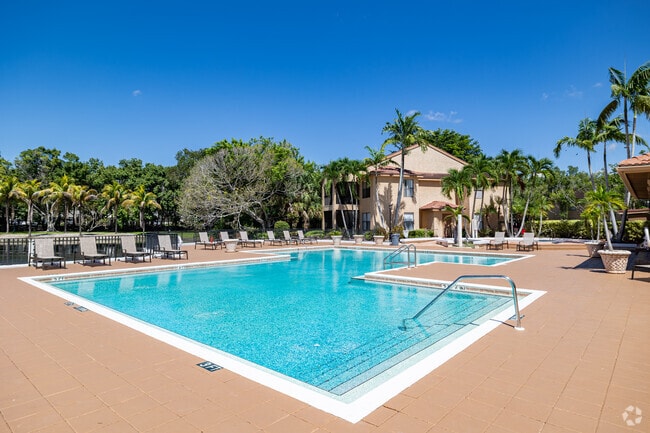 Sparkling Outdoor Pool with Expansive Sundeck - Oasis Naples Apartments
