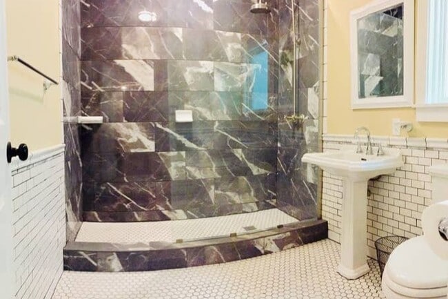 Beautiful new bathroom with a walk-in shower. - 816 W Hopkins St