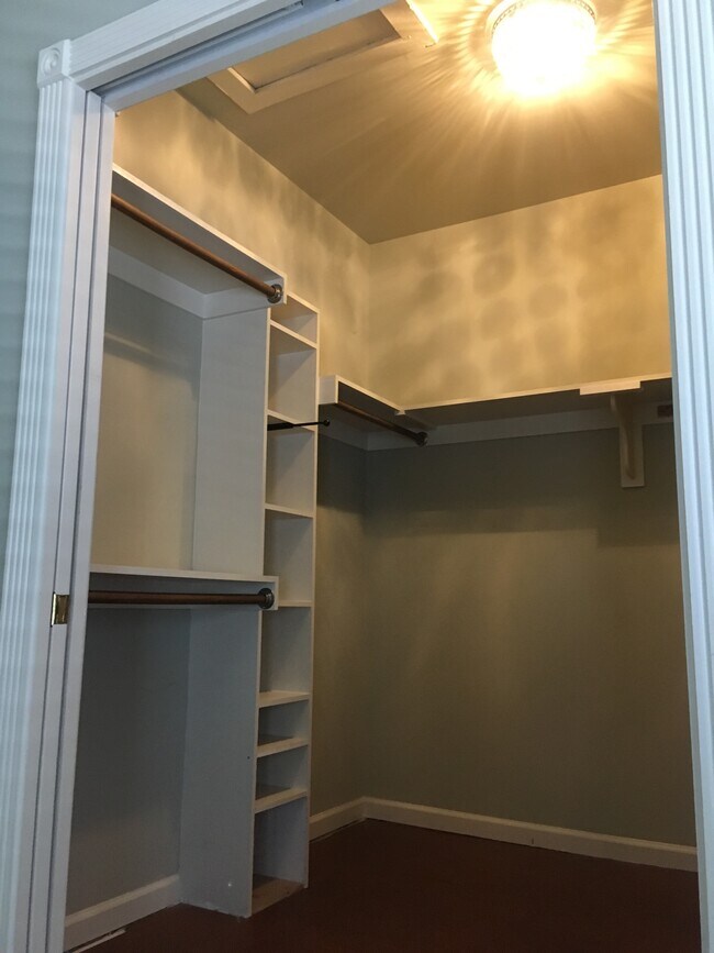 Storage in walk-in closet. Pocket doors maximize space. - 611 E Martin St
