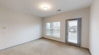 This contemporary 820 square foot apartment offers a well-designed living space with two bedrooms and two bathrooms. The heart of the home is the open-concept kitchen, featuring sleek gray cabinetry, granite countertops, and stainless steel appliances. A spacious island with a sink provides additional prep space and casual dining options.

The primary bedroom, measuring 140 square feet, offers ample space and is complemented by plush carpeting for comfort. Large windows in the bedrooms and living areas allow for natural light to flood the space, creating a bright and airy atmosphere. The bathrooms are modern and functional, with one featuring a expansive vanity and wooden flooring.

Throughout the apartment, you'll find a harmonious blend of materials, including hardwood floors in the main living areas and soft carpeting in the bedrooms. The neutral color palette provides a versatile backdrop for various decor styles. A private balcony offers outdoor space and views of the surrounding area.

Located at 4540 Gender Rd, the property benefits from convenient parking facilities and is part of a well-maintained complex. With its thoughtful layout and modern amenities, this apartment provides a comfortable and stylish living environment.