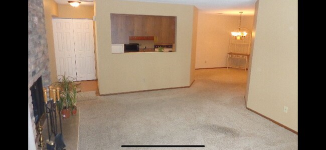 View from living room into kitchen and dining room - 1829 Zanzibar Ln N