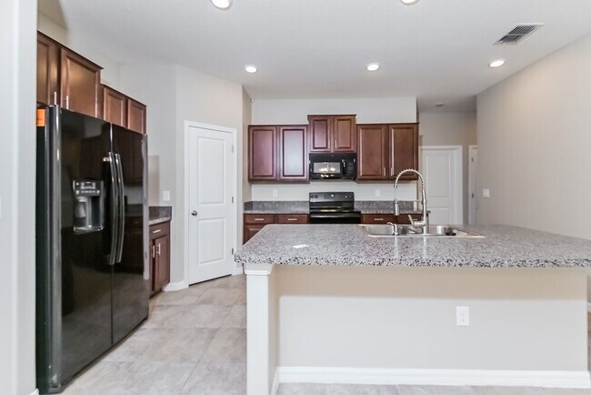 Building Photo - 10009 Rose Petal Pl