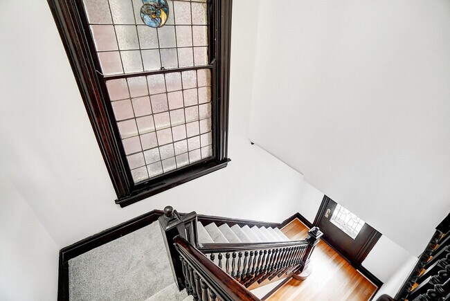 Looking down front stairway - 312 E 3rd St