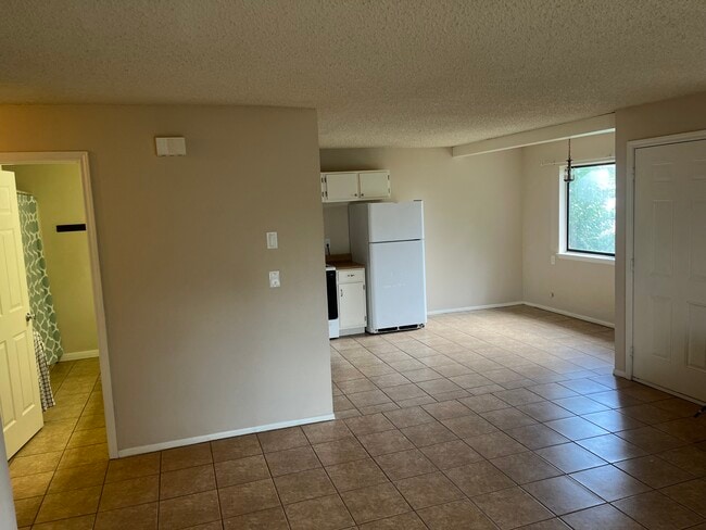 Living Room view towards Kitchen and Bathroom - 321 Eagles Nest Dr