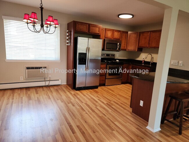 Building Photo - Spacious, Updated Condominium with Two Ful...