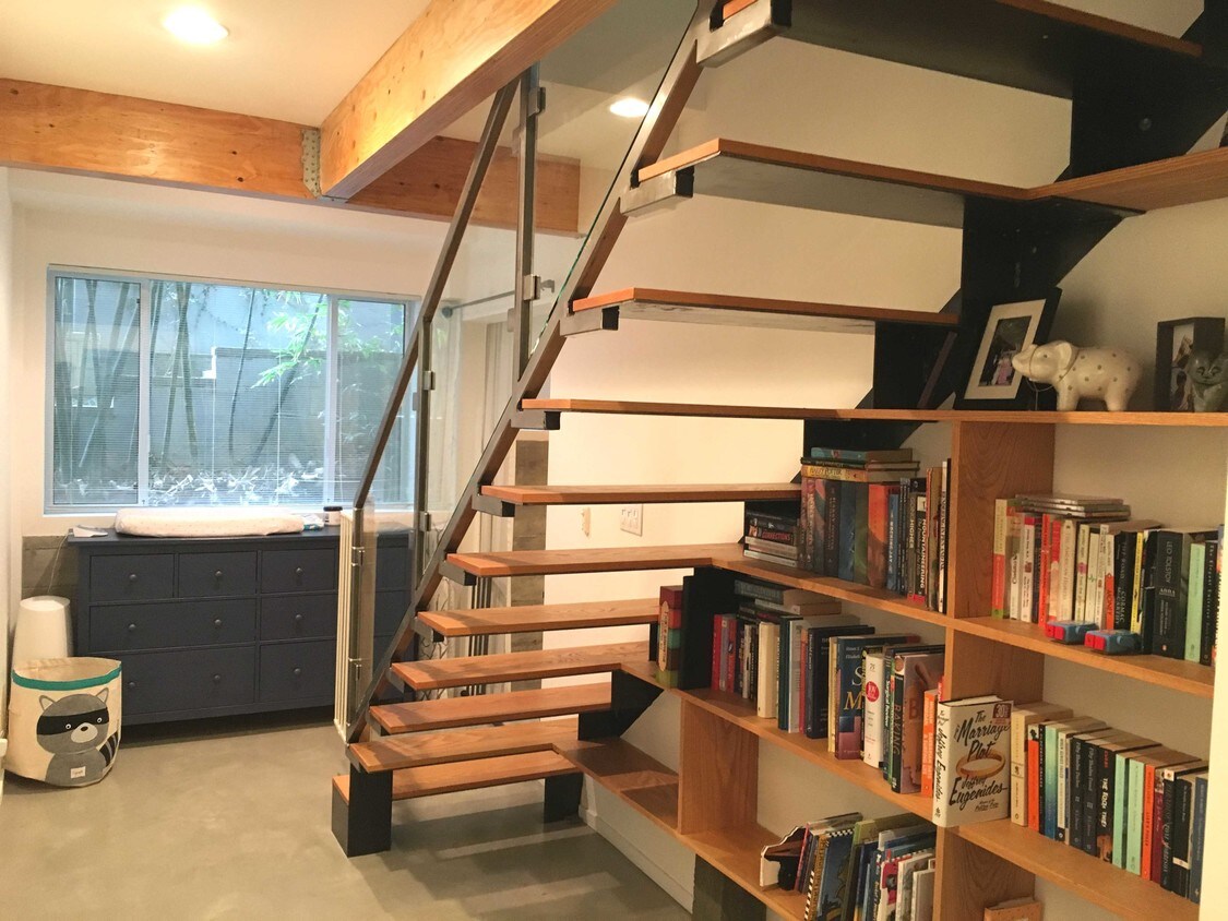Lower Level Hall, Stairs & Built-In Bookcase - 11732 Dorothy St