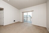 Located at 3311 Steamboat Way in Muscatine, Iowa, this one-bedroom, one-bathroom residence offers a practical and well-organized single-floor layout. The living room is bright and inviting, featuring soft carpeting and sliding glass doors that open onto a private balcony, allowing natural light to fill the space and providing pleasant outdoor views. The bedroom is a comfortable size, finished with the same warm carpeting, and includes a double-door closet offering generous storage. Its clean, neutral walls create a calm and versatile atmosphere. The kitchen is thoughtfully designed with tall cabinetry finished in white with wood-tone trim, providing ample storage and counter space. It comes equipped with a full suite of appliances, including a refrigerator, electric range, built-in microwave, dishwasher, and sink. Light-toned flooring ties the space together cleanly. The bathroom features a full tub-shower combination, toilet, and vanity with sink, all finished in a crisp white palette. Additional highlights include a dedicated laundry area and a hallway that connects the rooms efficiently. The overall aesthetic is clean, neutral, and move-in ready, making it a straightforward and functional home.
