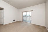 Located at 3311 Steamboat Way in Muscatine, Iowa, this one-bedroom, one-bathroom residence offers a practical and well-organized single-floor layout. The living room is bright and inviting, featuring soft carpeting and sliding glass doors that open onto a private balcony, allowing natural light to fill the space and providing pleasant outdoor views. The bedroom is a comfortable size, finished with the same warm carpeting, and includes a double-door closet offering generous storage. Its clean, neutral walls create a calm and versatile atmosphere. The kitchen is thoughtfully designed with tall cabinetry finished in white with wood-tone trim, providing ample storage and counter space. It comes equipped with a full suite of appliances, including a refrigerator, electric range, built-in microwave, dishwasher, and sink. Light-toned flooring ties the space together cleanly. The bathroom features a full tub-shower combination, toilet, and vanity with sink, all finished in a crisp white palette. Additional highlights include a dedicated laundry area and a hallway that connects the rooms efficiently. The overall aesthetic is clean, neutral, and move-in ready, making it a straightforward and functional home.