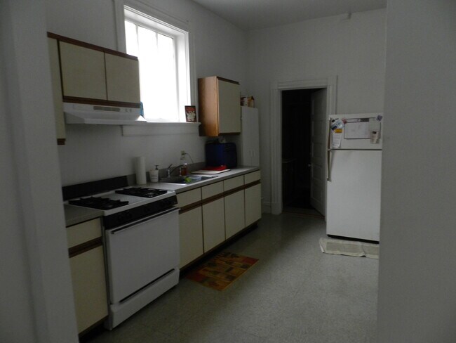 Kitchen + Newer fridge - 2324 W Grace St