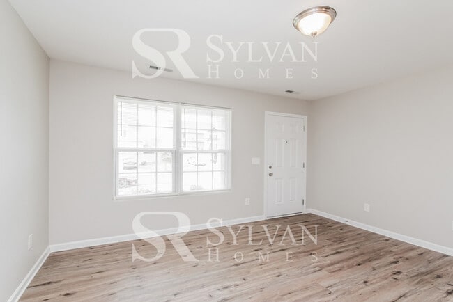 Building Photo - Turn the key. Enter. Smile. Repeat every day!