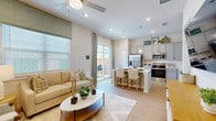 Located in Melissa, TX, this well-appointed 2-bedroom, 3-bathroom single-story home offers a bright and functional layout designed for comfortable living. Light wood-style flooring flows seamlessly throughout, tying the spaces together with a warm, cohesive aesthetic.

The welcoming entrance hallway leads directly into an open-concept living and kitchen area filled with natural light from large windows and a sliding glass door. The kitchen features gray shaker-style cabinetry, white quartz countertops, stainless steel appliances, a center island with bar seating, and a dedicated pantry. The adjoining living room is spacious and airy, highlighted by a ceiling fan and easy access to a private outdoor patio.

The primary bedroom is a serene retreat with a ceiling fan, a large window, and direct access to an en-suite bathroom. The primary bath showcases a dual-sink vanity with gray cabinetry, a glass-enclosed walk-in shower with tile surround, and a dedicated walk-in closet. The second bedroom is comfortably sized with its own ceiling fan, closet access, and a bright window. A convenient in-unit laundry area and three total closets round out the practical features of this home.