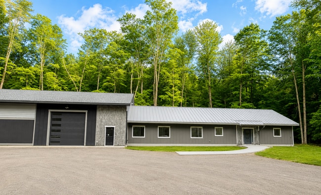 10 ft. garage door. Ample indoor & outdoor parking. - 10671 US 31