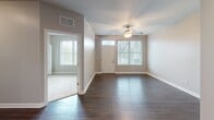 Located on Lake Superior Road in Valparaiso, Indiana, this two-bedroom, two-bathroom residence offers a thoughtfully designed single-floor layout with a comfortable and cohesive aesthetic throughout. The open living area welcomes you with rich dark hardwood-style flooring, neutral walls, and multiple windows that bring in generous natural light. A ceiling fan adds both function and character to the space.

The kitchen is well-equipped and features rich dark cabinetry extending to the ceiling, granite countertops, stainless steel appliances including a gas range, dishwasher, microwave, and a French door refrigerator with ice maker. A louvered utility closet conveniently houses the in-unit washer.

Both bedrooms are carpeted and finished in warm neutral tones. The primary bedroom is a comfortable size and is served by a dedicated en-suite bathroom featuring a double-sink granite vanity with dark wood cabinetry and a separate glass-enclosed shower. The second bedroom offers natural light through a large window and includes a built-in closet. A second full bathroom includes a soaking tub with tiled surround and a granite-topped vanity. A spacious walk-in closet with wire shelving provides ample storage. The layout is completed by a connecting hallway that ties all rooms together efficiently.