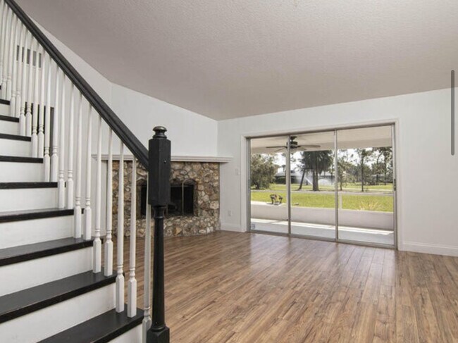 Living Room, Fireplace & Stairway Beautiful stairway overlooks large back yard & luxury golf views - 541 Inverness Ave