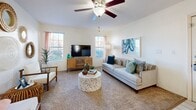 Located at 345 Shadow Mountain Drive in El Paso, TX, this single-floor, one-bedroom, one-bathroom residence offers a well-organized and inviting layout. The galley-style kitchen is thoughtfully designed with cream cabinetry, light marble-look countertops, hardwood-style flooring, and a full suite of stainless steel appliances, including a range, microwave, refrigerator, and dishwasher — maximizing every inch of the space. The combined kitchen and living area transitions seamlessly, with the living room featuring plush carpeting, a ceiling fan, and multiple windows that flood the room with natural light and views of the surroundings. The generously sized primary bedroom includes soft carpet flooring, a large sliding glass door providing outdoor access, and two closets for ample storage. The full bathroom is finished with wood-look flooring, a single vanity with a marble-look countertop, and a tub-shower combination. Throughout the residence, the warm, neutral color palette and bright white walls create a clean, welcoming ambiance. The overall layout is efficient and practical, making excellent use of the available space while maintaining a comfortable, livable feel suited for El Paso's vibrant Shadow Mountain neighborhood.