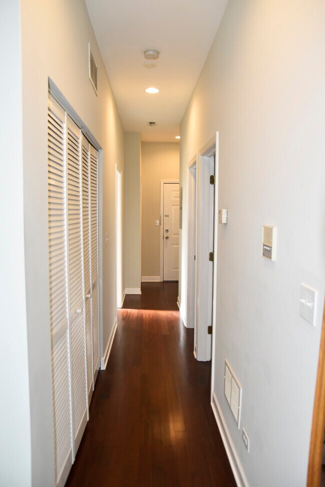 Hallway on the south end of the unit, leading to the bedrooms and bathrooms - 2315 W Rice St