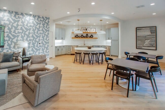 Community Lounge with Multiple Seating Areas and Shared Kitchen - The Maggie