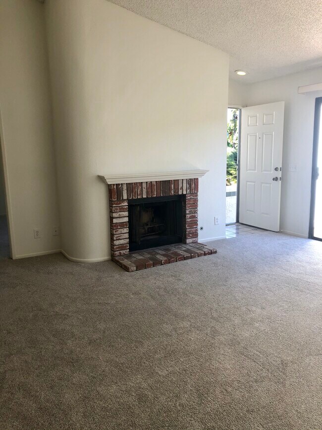 Living room with gas fireplace - 9380 Twin Trails Dr