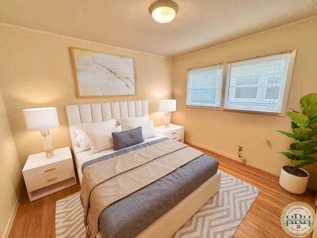 Building Photo - Spacious & Bright 2BR|1BA w/ One Garage Parking Spot Included