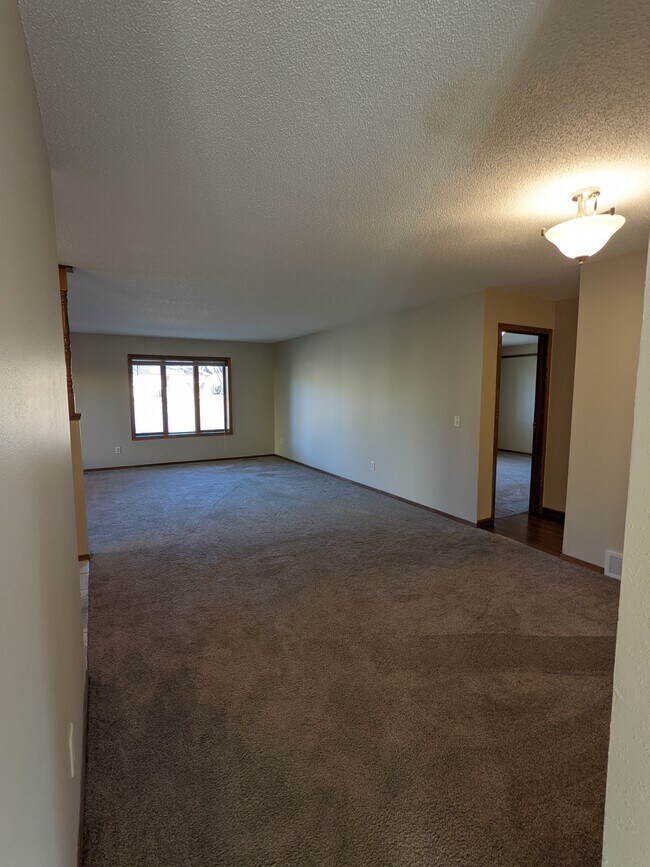 Living room with dining area with all new windows facing 57th street - 507 E 57th St