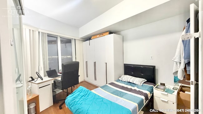 Photo du bâtiment - 50 Absolute Av