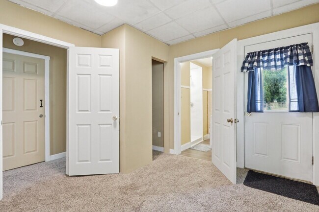 Building Photo - This well-maintained 4-bedroom, 2-bath duplex offers a spacious layout with all the comforts of h...