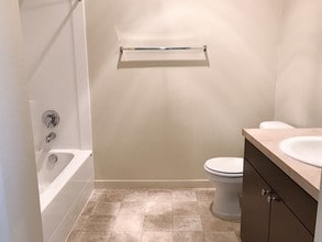 Claystone Dark Guest Bathroom - Stoneplace Apartment Homes