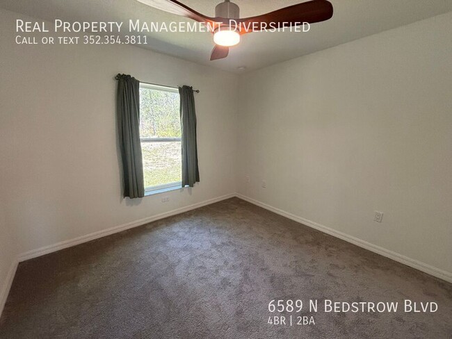 Building Photo - 6589 N Bedstrow Blvd