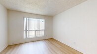 Located at 5333 E Thomas Rd in Phoenix, AZ, this single-story, one-bedroom, one-bathroom unit offers a clean and functional layout designed for comfortable everyday living. Light wood-style flooring runs throughout the entire space, creating a warm and cohesive aesthetic that ties each room together.

Upon entry, residents are welcomed into an open combined kitchen and living area. The kitchen features white cabinetry, a gas range, a full-size refrigerator, and a sink with ample counter space — all finished in a crisp, neutral palette. The adjoining living space provides a versatile area that flows naturally from the kitchen.

A hallway connects the main living area to the private quarters, which include two closets, a full bathroom, and the bedroom. The bedroom is a well-proportioned retreat featuring a large window with vertical blinds that invites natural light and views of the surrounding area. The bathroom is outfitted with a shower/tub combo, toilet, and vanity, all finished in clean white tones.

Throughout the unit, textured ceilings, bright white walls, and an abundance of natural light from multiple windows contribute to an airy and welcoming ambiance. The efficient floor plan makes excellent use of every square foot, offering a practical and comfortable living environment in the heart of Phoenix.