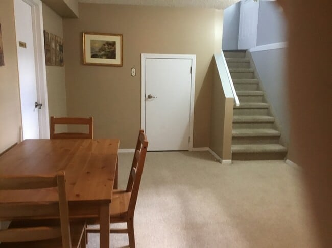 Staircase to back yard (with doggy door) - 240 Woodpark Pl SW