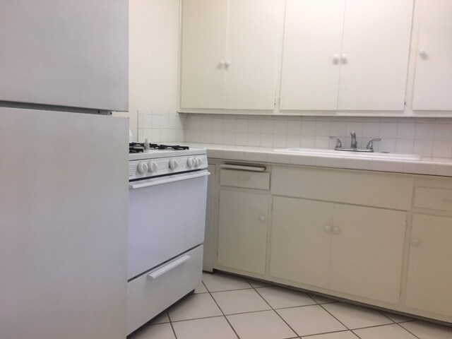 Includes refrigerator and gas stove - 7344 W Manchester Ave