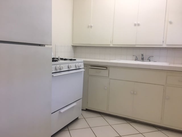 Includes refrigerator and gas stove - 7344 W Manchester Ave