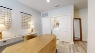 Located in Georgetown, TX, this thoughtfully designed three-bedroom, three-bathroom home spans three floors, offering a functional and modern living experience. The entry level provides a welcoming introduction to the space, while the main floor hosts an open-concept kitchen and living area bathed in natural light from large windows. The kitchen is appointed with crisp white shaker cabinetry, granite countertops, stainless steel appliances, a tile backsplash, and a central island with bar seating — ideal for both everyday meals and entertaining. Light wood-style flooring runs throughout the main living areas, complementing the clean, neutral color palette. The living room is generously sized with large windows that invite natural light and views of the surrounding neighborhood. Upper floors house all three bedrooms, each featuring plush carpeting, ceiling fans, and windows with natural light. The primary bedroom offers a comfortable private retreat, while the additional bedrooms provide versatile space suited for guests or a home office. All three bathrooms are finished with granite vanities, tile-surround tub-shower combinations, and wood-look flooring, maintaining a consistent, polished aesthetic throughout the home.