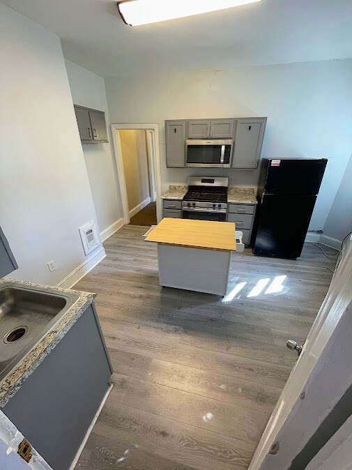 Kitchen Includes Island - 2432 E Norris St Apartments