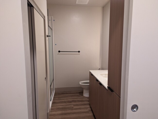 Bathroom with farm style door - 107 E Little Ave