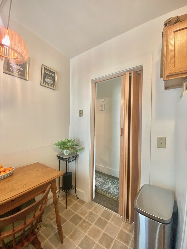 kitchen entry, we installed this acordian door and we will leave it for you if you'd like - 416 N Paterson St
