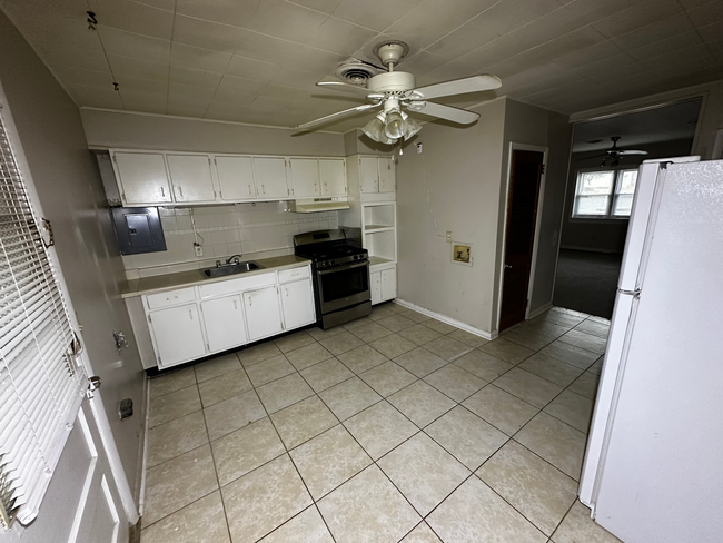 In the back of the first floor is a large eat-in kitchen with washer and dryer hookups - 6 Catawba Ave