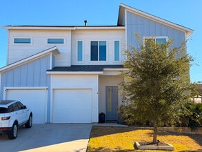Exterior Front: Modern curb appeal with double garage and clean landscaping—a fresh, welcoming look - 11001 Charger Way