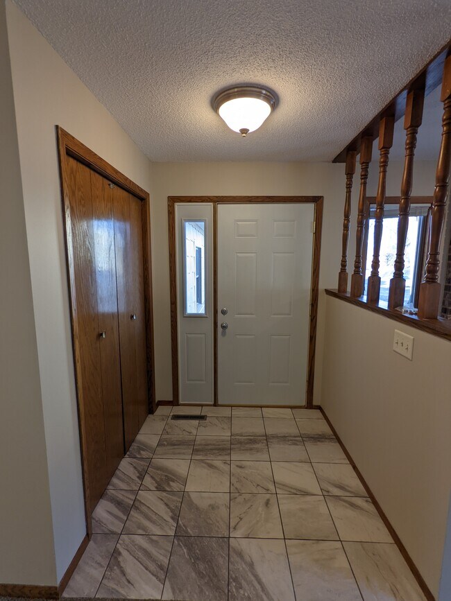 Front door access off 57th street with new tile entry. - 507 E 57th St