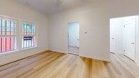 Located at 132 S Westmoreland Ave in the heart of Los Angeles, CA, this efficiently designed single-floor unit offers a practical and thoughtfully arranged layout. The space includes a welcoming entrance, a living room, a kitchen, one full bathroom, and two closets, making smart use of every square foot.

Throughout the unit, light-toned hardwood flooring creates a warm, cohesive look that ties each room together. The crisp white walls and clean baseboards contribute to a bright, modern atmosphere. The living room benefits from natural light through a window with views of the surrounding brick exterior, giving the space a grounded urban character.

The kitchen is efficiently laid out with white shaker-style cabinetry, light countertops, a stainless steel refrigerator, and a window that allows natural light to filter in. The galley-style configuration maximizes usability within a compact footprint.

The bathroom is well-appointed with large-format gray marble-style tile lining the tub surround from floor to ceiling, complemented by light wood-look flooring, a toilet, and a small window for ventilation. The clean finishes give it a polished, contemporary feel.

Two closets provide practical storage solutions throughout the unit. Overall, this space presents a clean, move-in-ready environment with consistent modern finishes suited for comfortable urban living in Los Angeles.