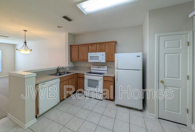Foto del edificio - 8428 Thornbush Ct