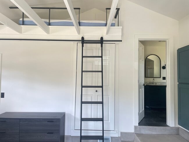The ladder to the sleeping loft is moveable, but also locks into place for safety - 2220 Belmont Ave