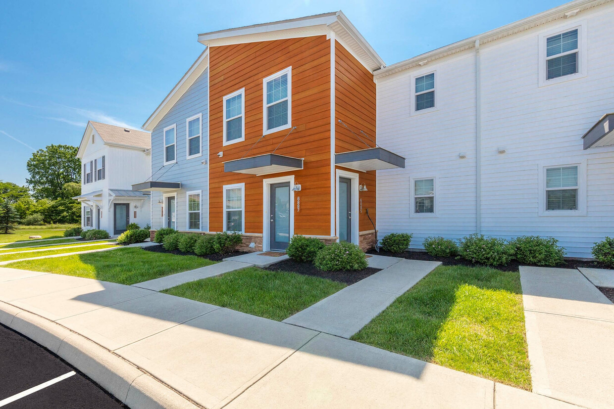 Experience modern elegance with this colorful townhouse exterior. - The Gramercy