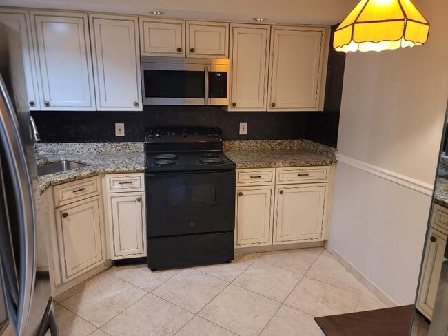 Building Photo - 8657 Boca Glades Blvd W