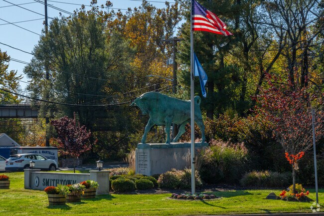 A statue of Whisper the Bull greets visitors as they enter Smithtown.