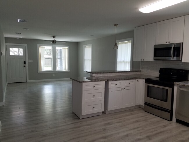 Kitchen bar overlooking Living Room - 1306 Red Bird St